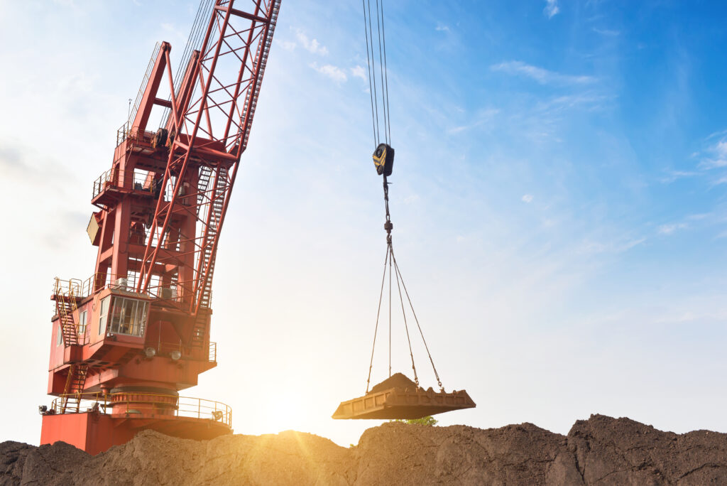 the crane is carrying the dirt