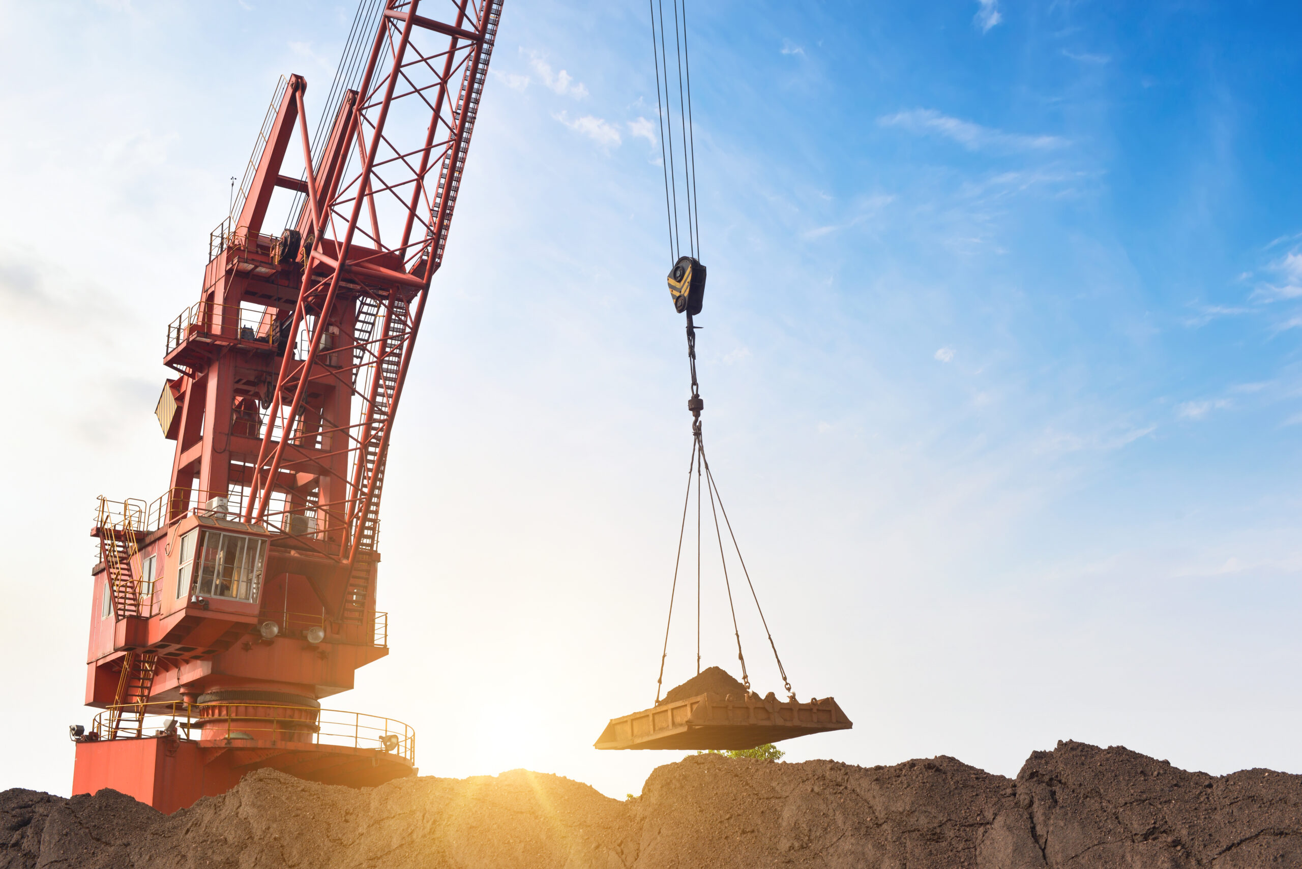 the crane is carrying the dirt